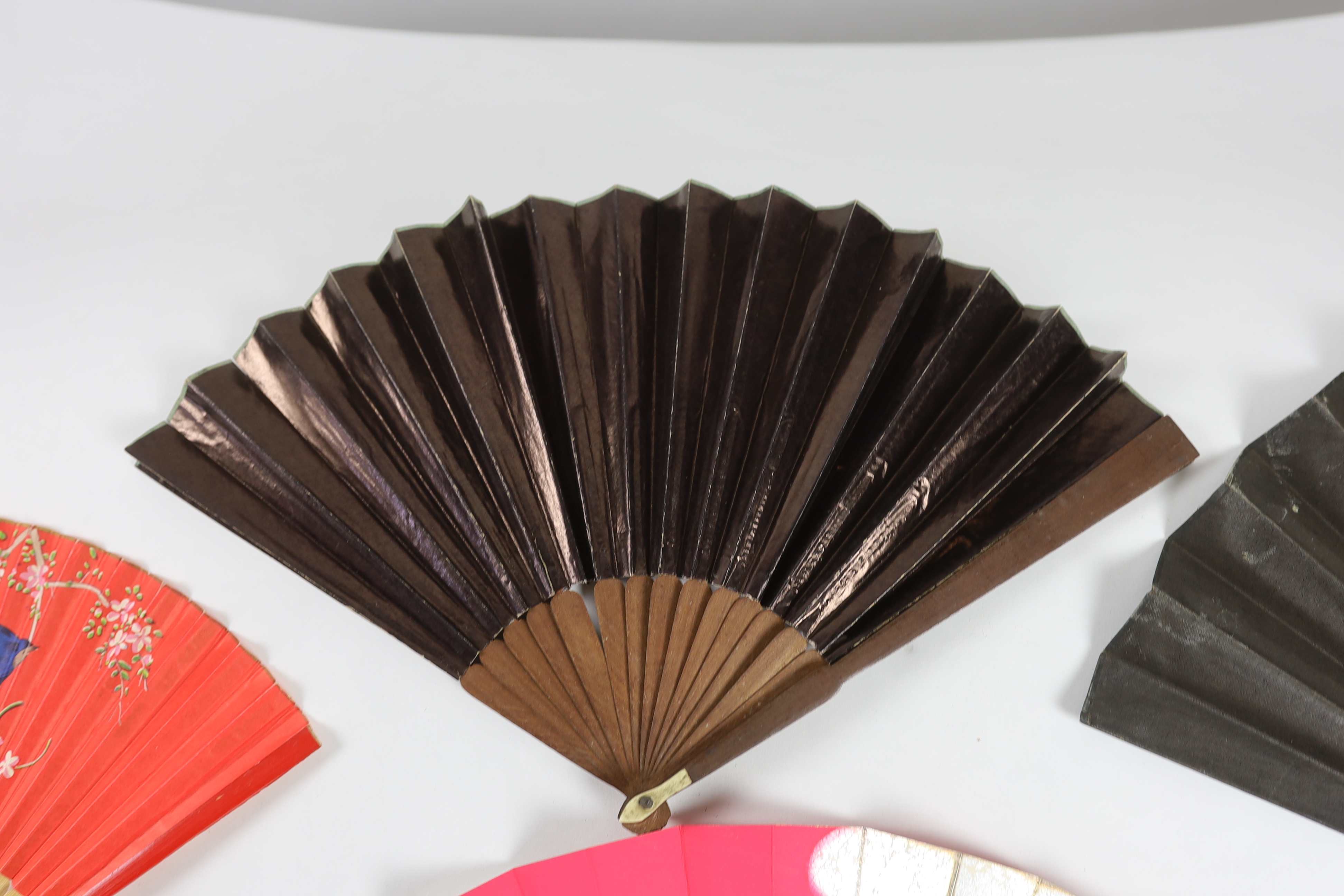 A collection of 19th and 20th century mostly paper fans, ten in reasonable condition useful for stage and film (16)